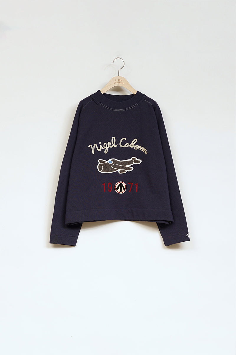 【ナイジェル・ケーボン】WOMAN / レターパッチスウェットプルオーバー / LETTER PATCH SWEAT P/O